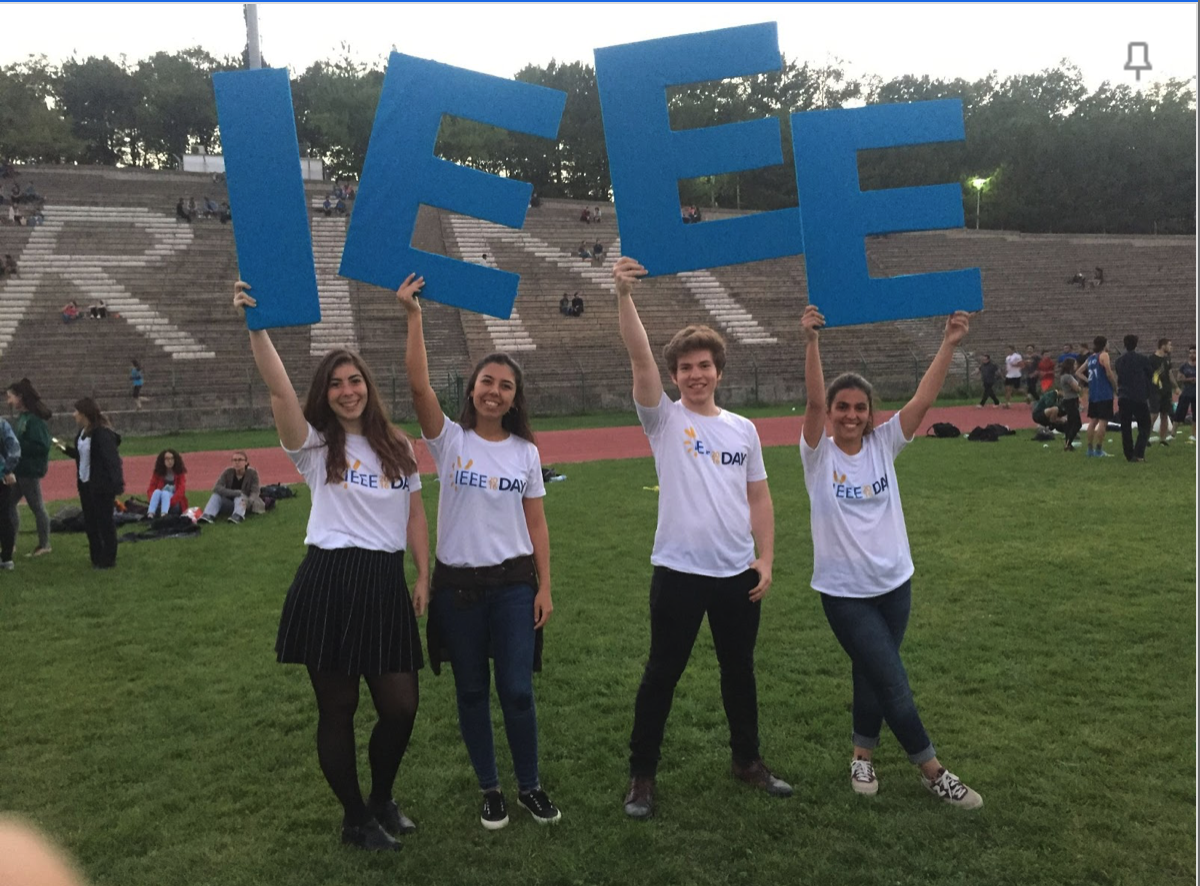 4 Students Holding up the letters IEEE